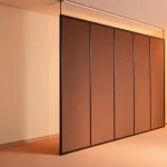 Transform spaces with a Folding Partition Wall, showcasing its seamless design and versatile functionality in a modern setting.