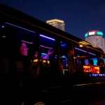 Enjoy a limo party bus in Athens, GA, with vibrant lights and joyful passengers celebrating their night out.