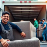 Experienced movers nyc loading furniture into a moving truck in vibrant urban surroundings